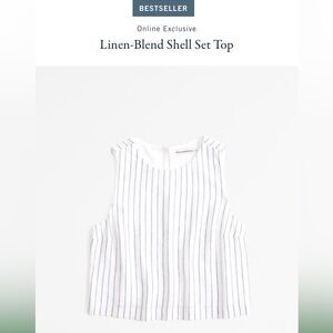 Gorgeous white linen blend shell tank top with denim blue vertical stripes.